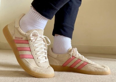 Adidas Handball Spezial in size 43 1/3 or 9 uk in beige furry suede with pink accents.