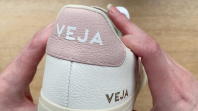 Close up of Veja Campo heel. The pebble effect on the ChromeFree leather & branding accents give a premium look and feel.