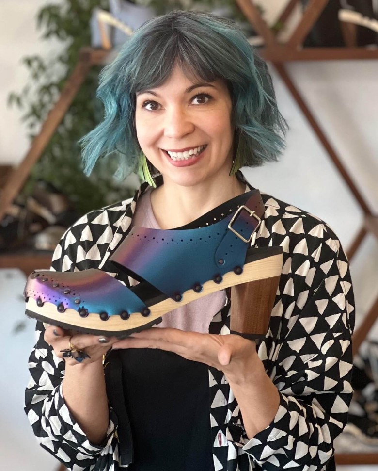 Annie from Mohop with a pair of size 17 shoes she made