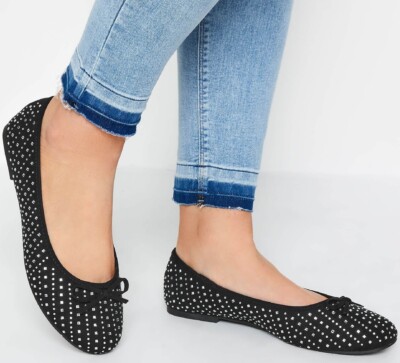 Extra wide fit black diamante ballet flats worn with jeans